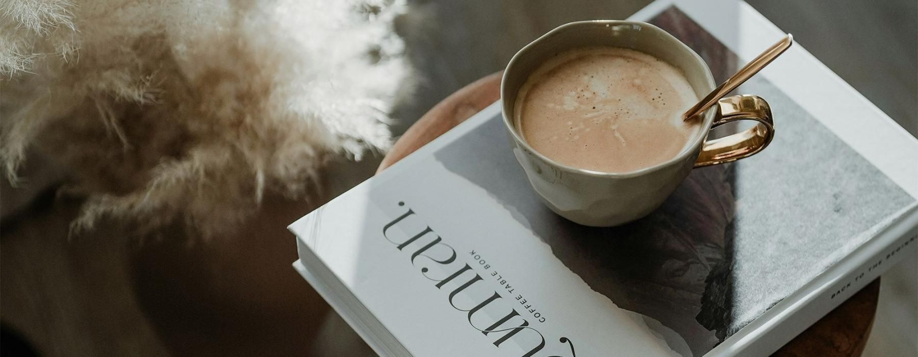 a cup of coffee on a book
